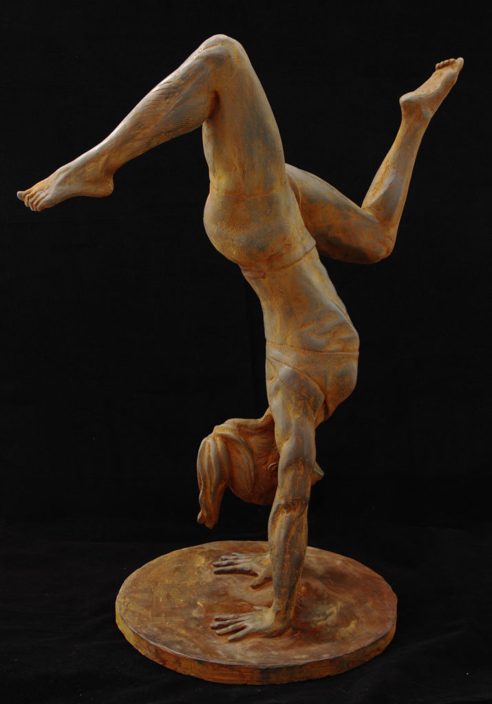Side view of a sculpture of CrossFit athlete Jenn Lymburner holding a handstand pose