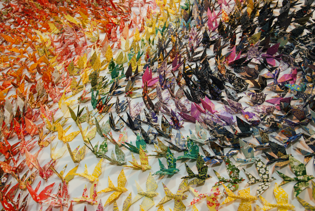 Close-up of artwork composed of origami swallows