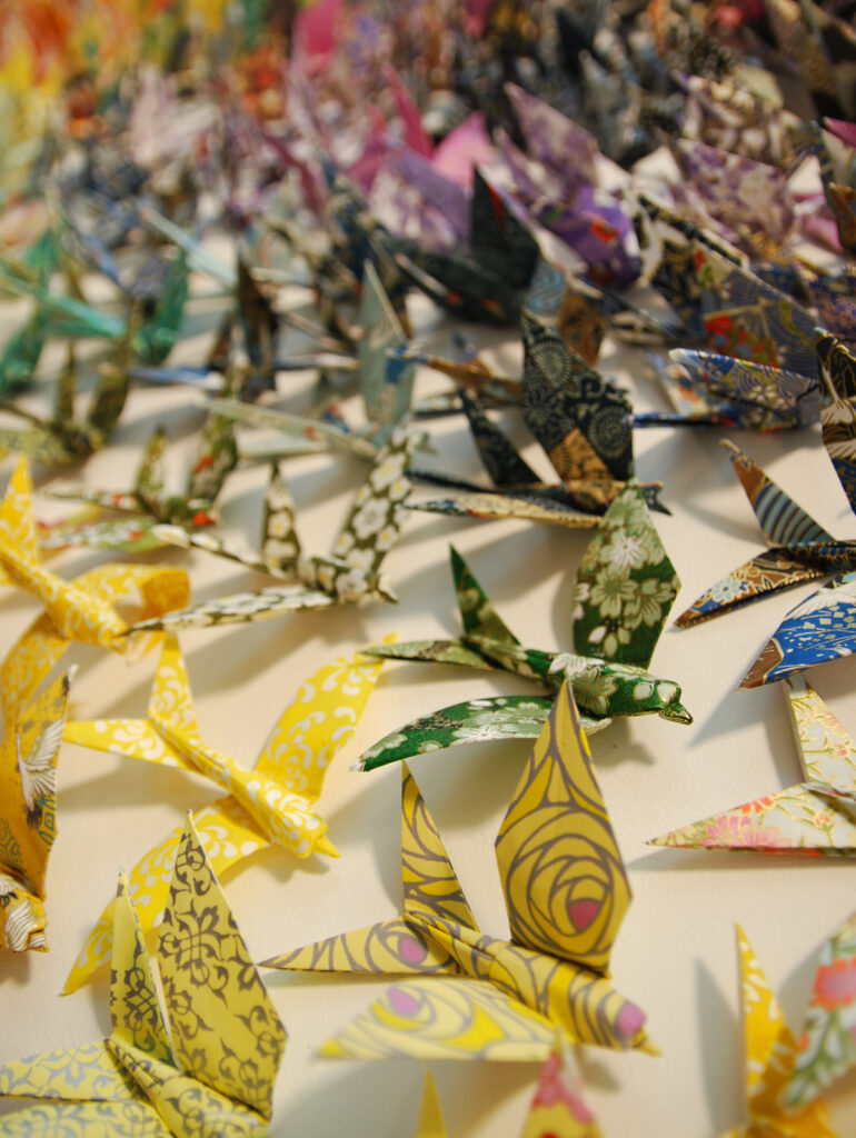 Close-up of origami swallows